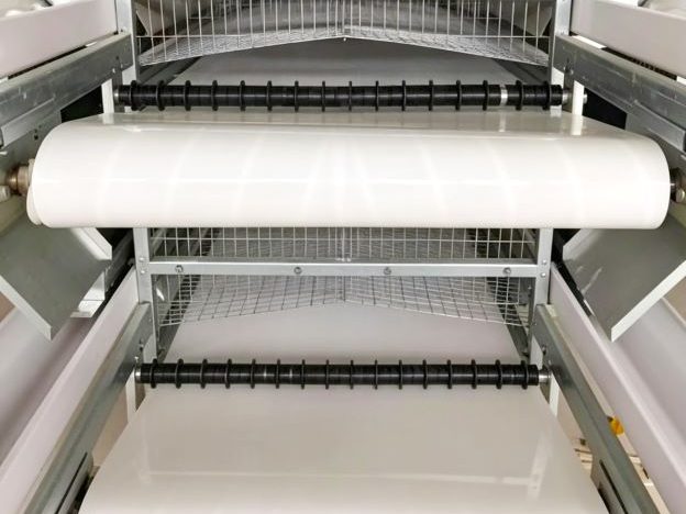 manure conveyor belt adjustment